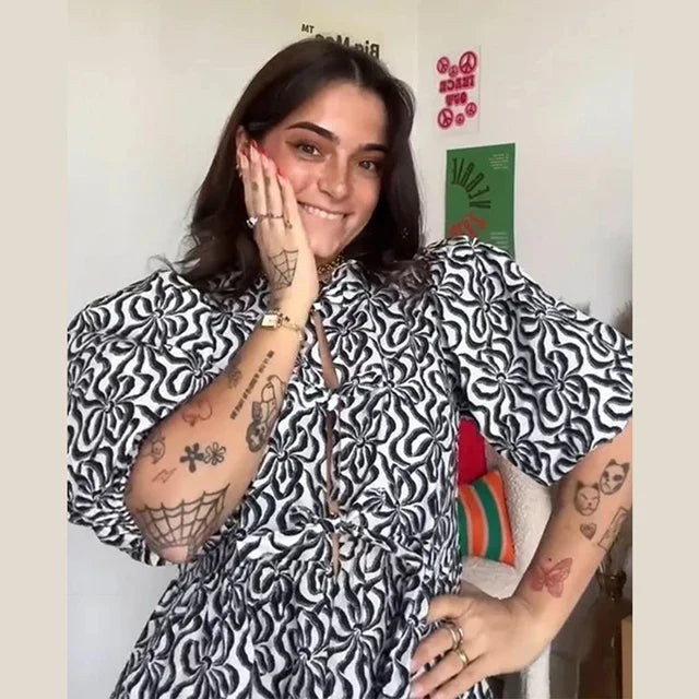 Bluse mit Leopardenmuster, Puffärmel und Schleifenakzent